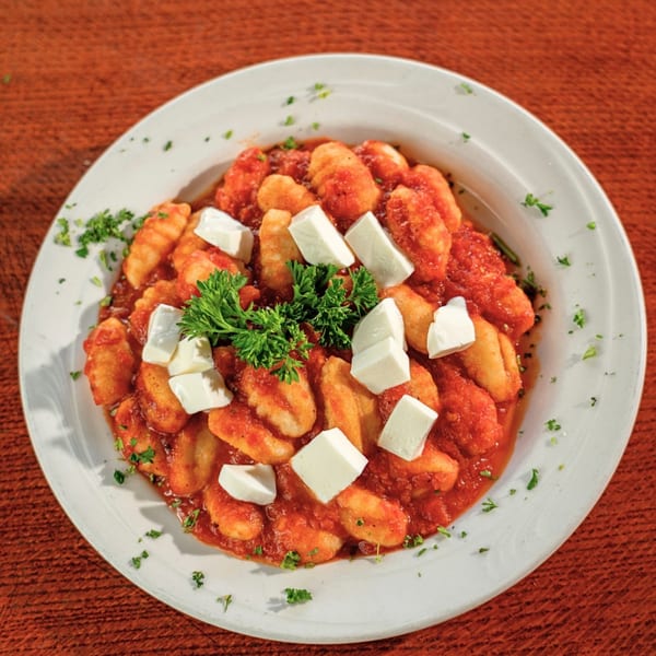 Mama Mia 44SW's gnocchi in red sauce, topped with fresh mozzarella cubes and parsley.